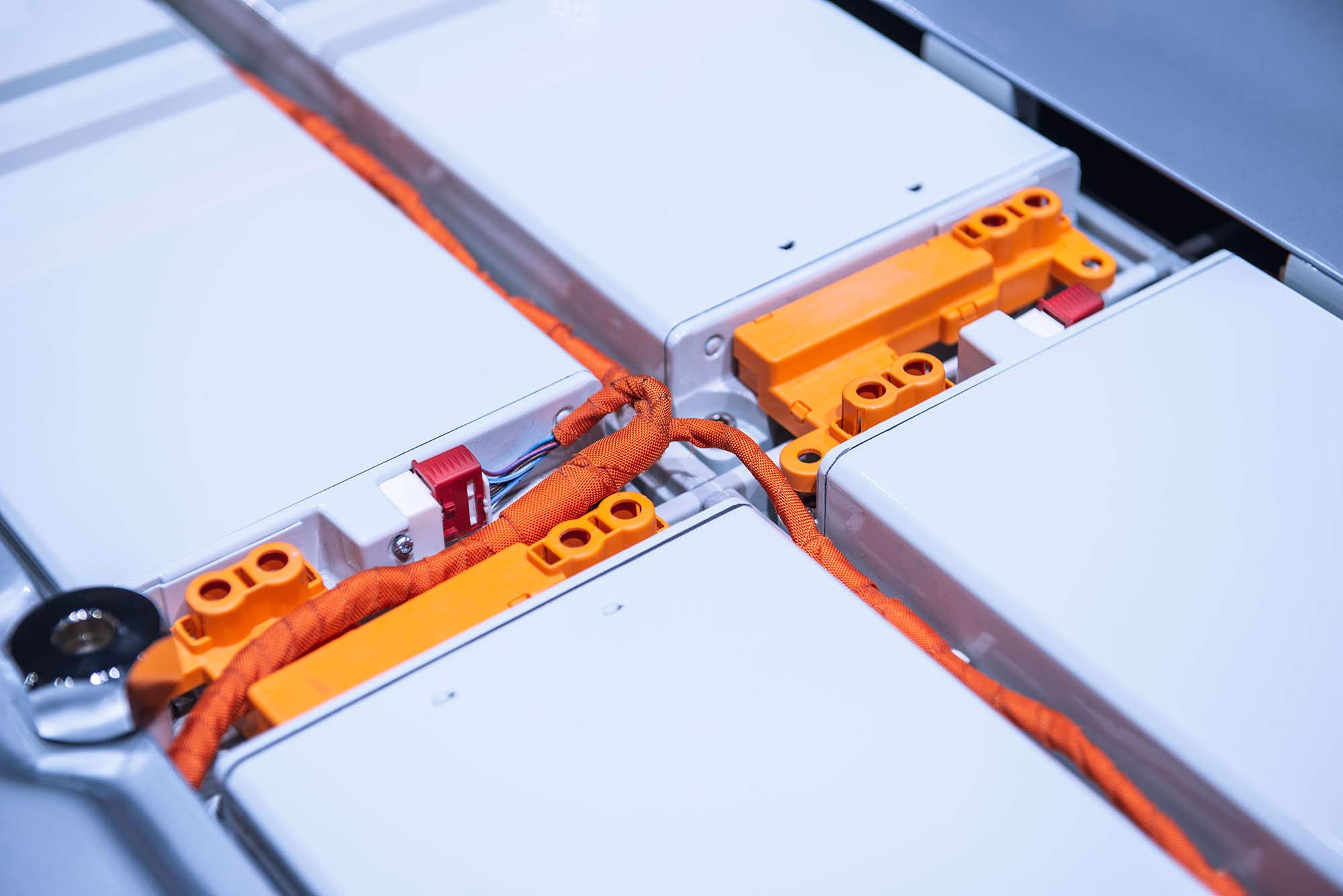 Automotive electrical connector housing with orange silicone sealing gasket